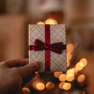 person holding white gift card